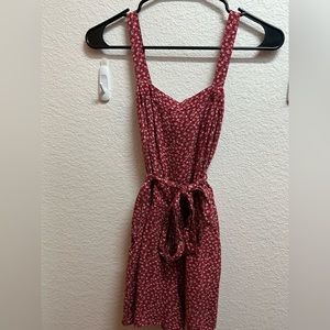 Red floral romper, lightly worn, adjustable straps, removable tie waist